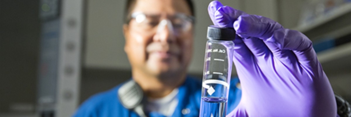 Man inspecting test tube